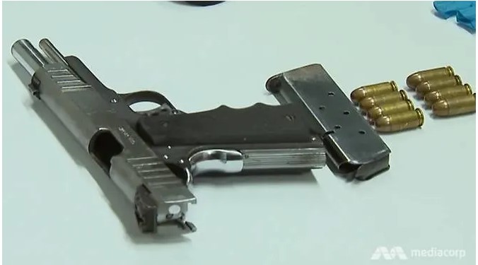 2_men_charged_over_loaded_pistol